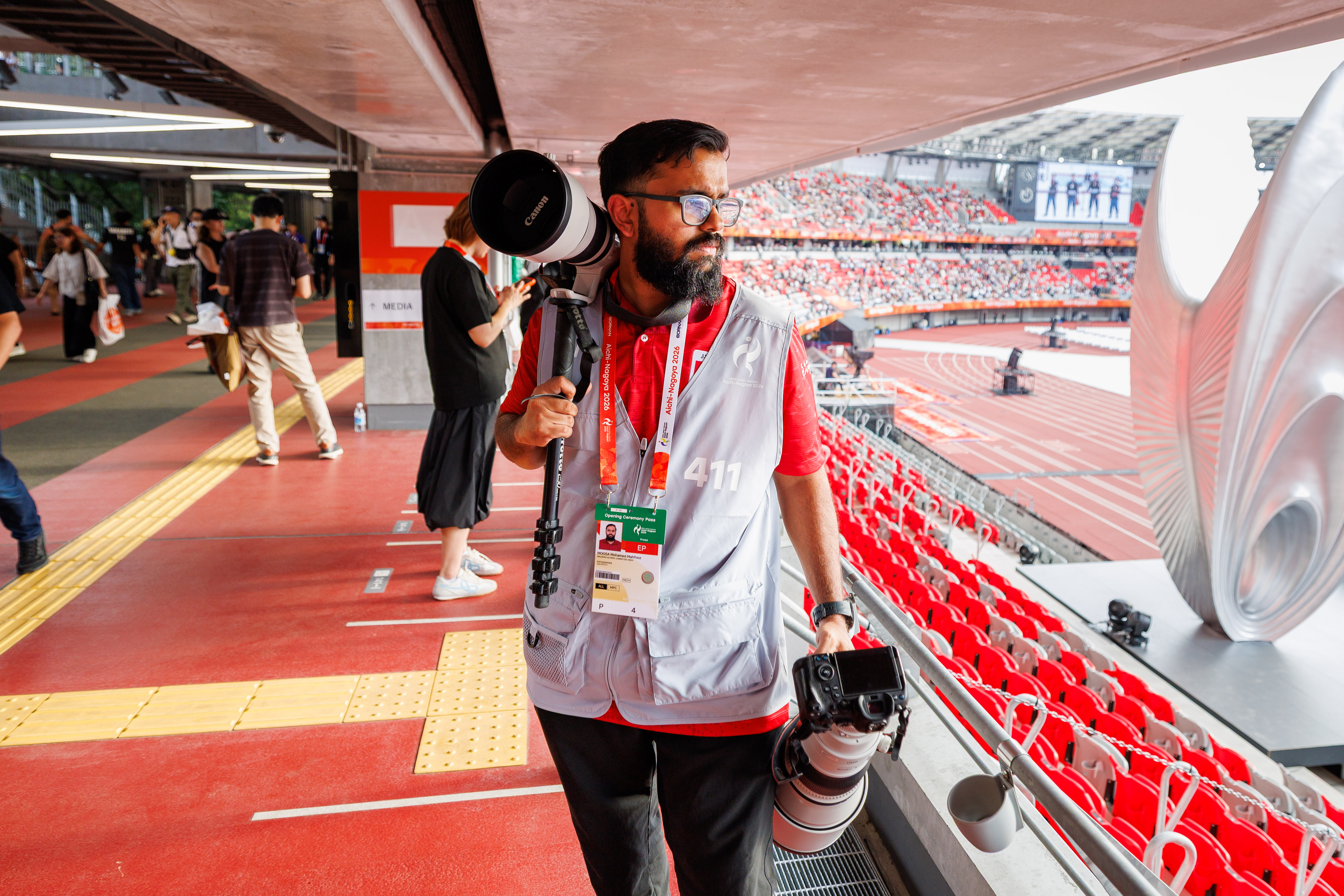 imagesmv Photographer Mohamed Mahfooz Moosa at the 20th Asian Games as part of Maldives Olympic Committee’s media team