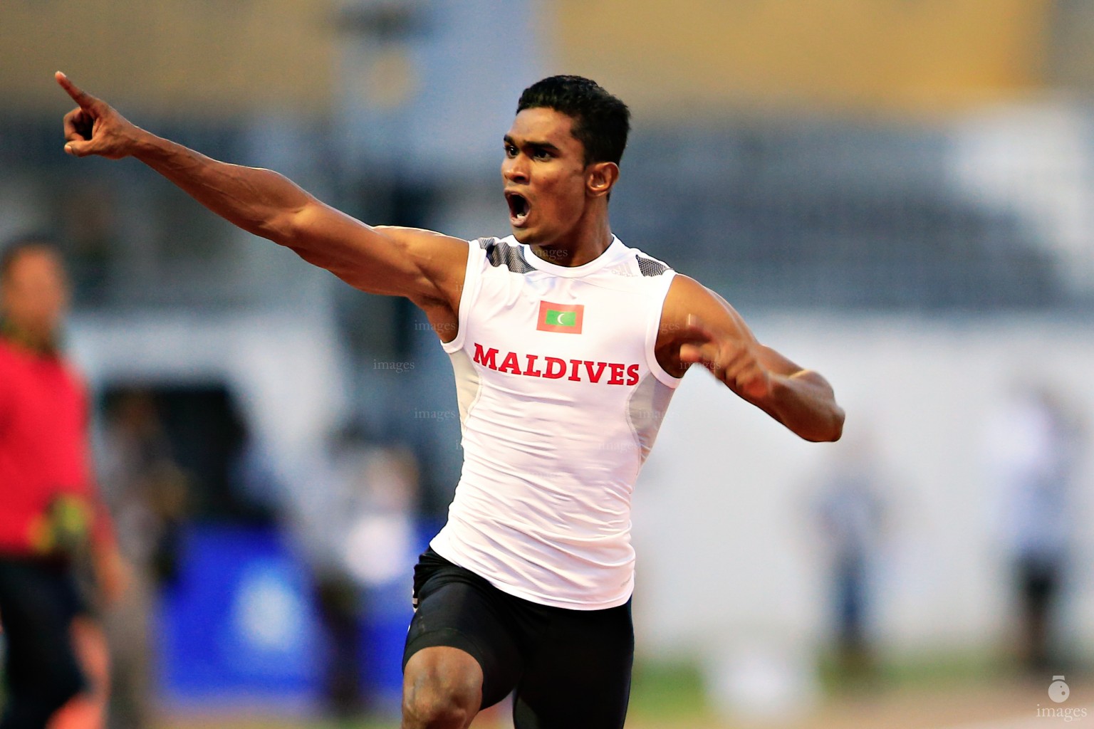 Hassan Said celebrates after finishing first in the 100m finals in Indian Ocean Island Games, La Reunion, Sunday, August. 2, 2015.  (Images.mv Photo/ Hussain Sinan).