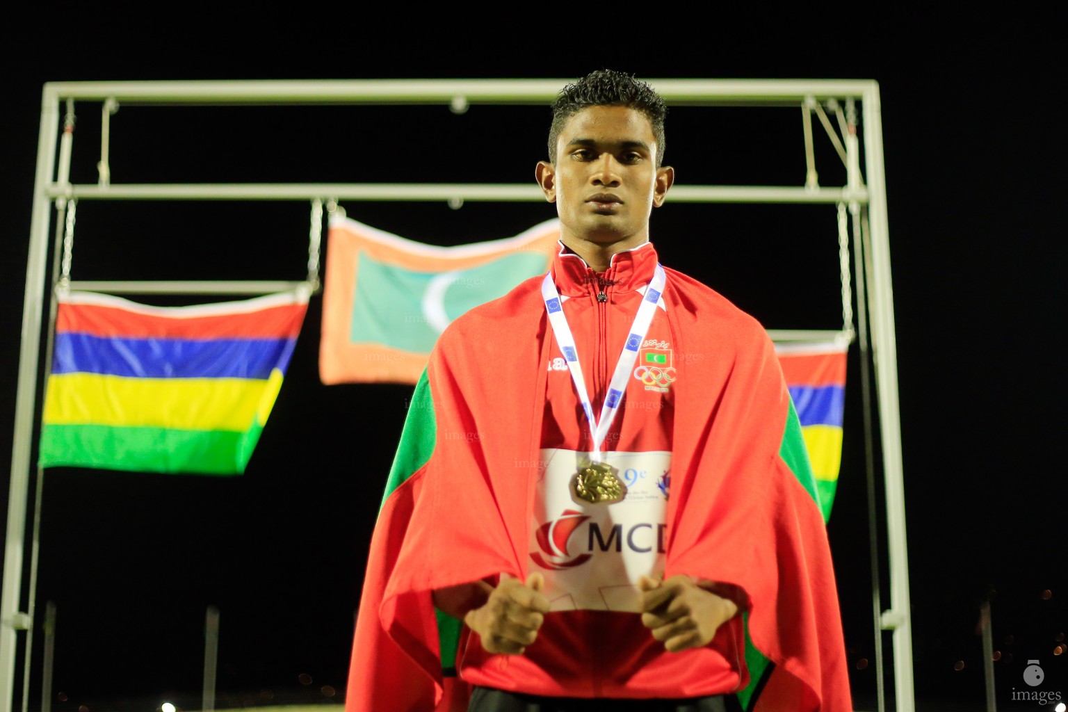 Hassan Said wins the first gold medal in an Olympics Event in the 100m finals in Indian Ocean Island Games, La Reunion, Sunday, August. 2, 2015.  (Images.mv Photo/ Hussain Sinan).