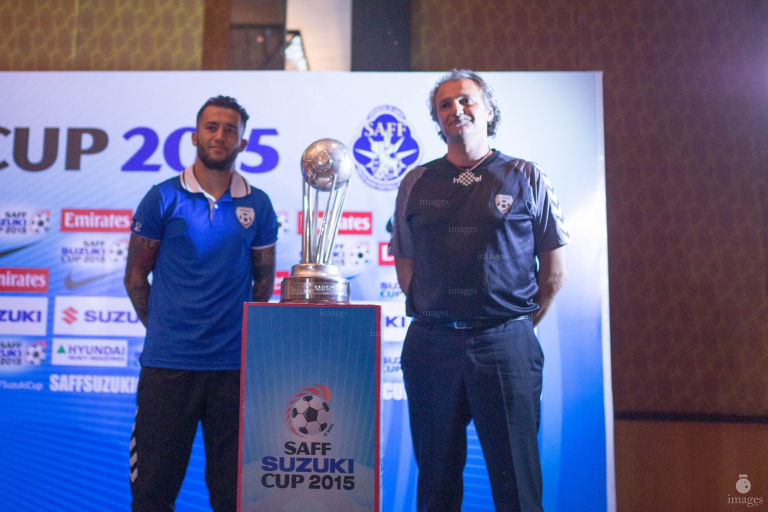 Afghanistan coach and captain poses with SAFF Suzuki Cup trophy ahead of the finals in Thiruvananthapuram, India, Thursday, January. 2, 2015.(Images.mv Photo/ Hussain Sinan).