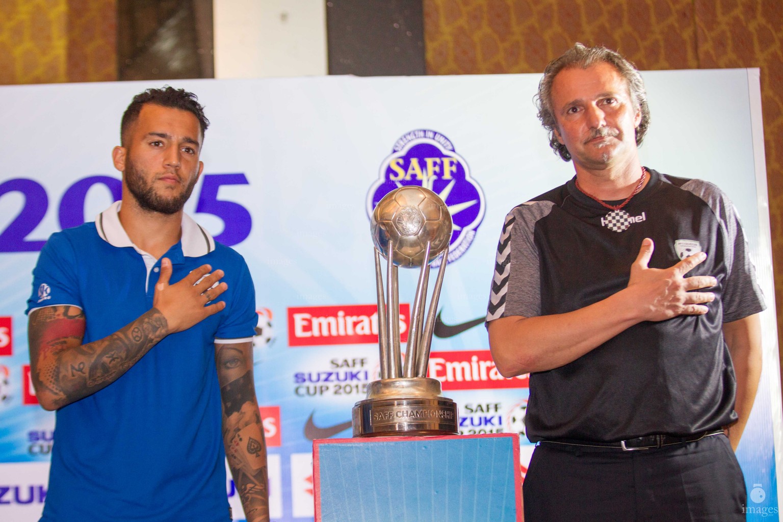 Afghanistan coach and captain poses with the SAFF Suzuki Cup trophy ahead of the finals in Thiruvananthapuram, India, Thursday, January. 2, 2015.  (Images.mv Photo/ Mohamed Ahsan).