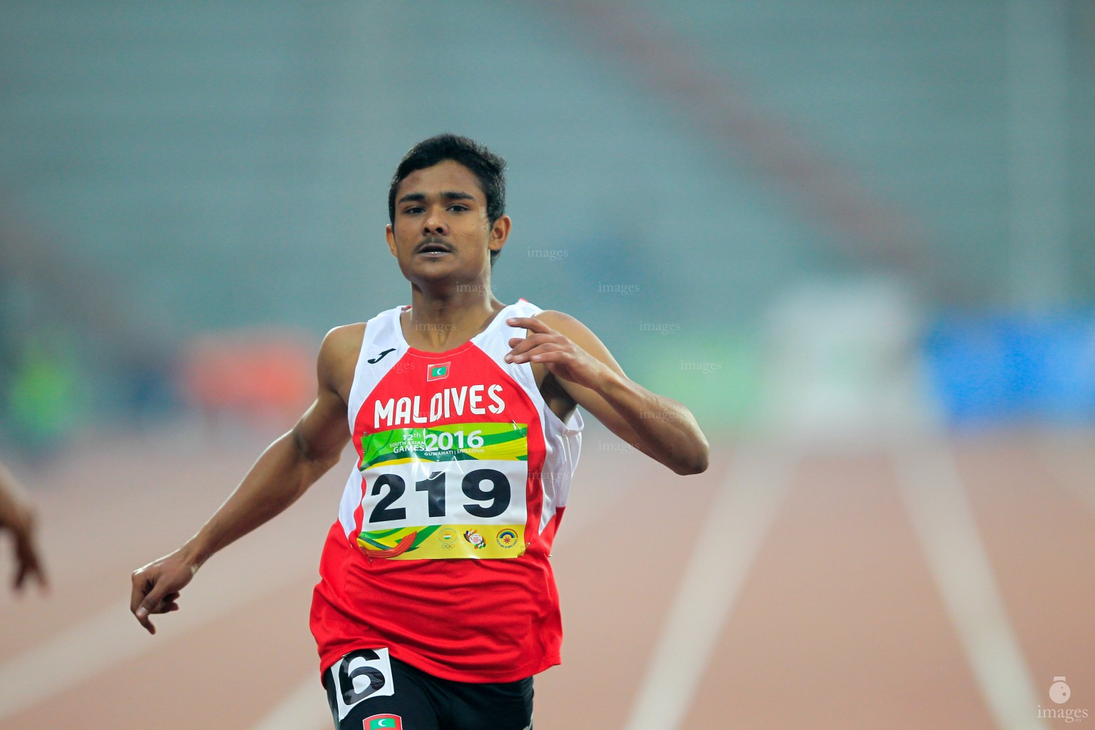 Ali Ibrahim runs in the 200m heats in the South Asian Games in Guwahati, India, Thursday, February. 11, 2016. (Images.mv Photo/ Hussain Sinan).