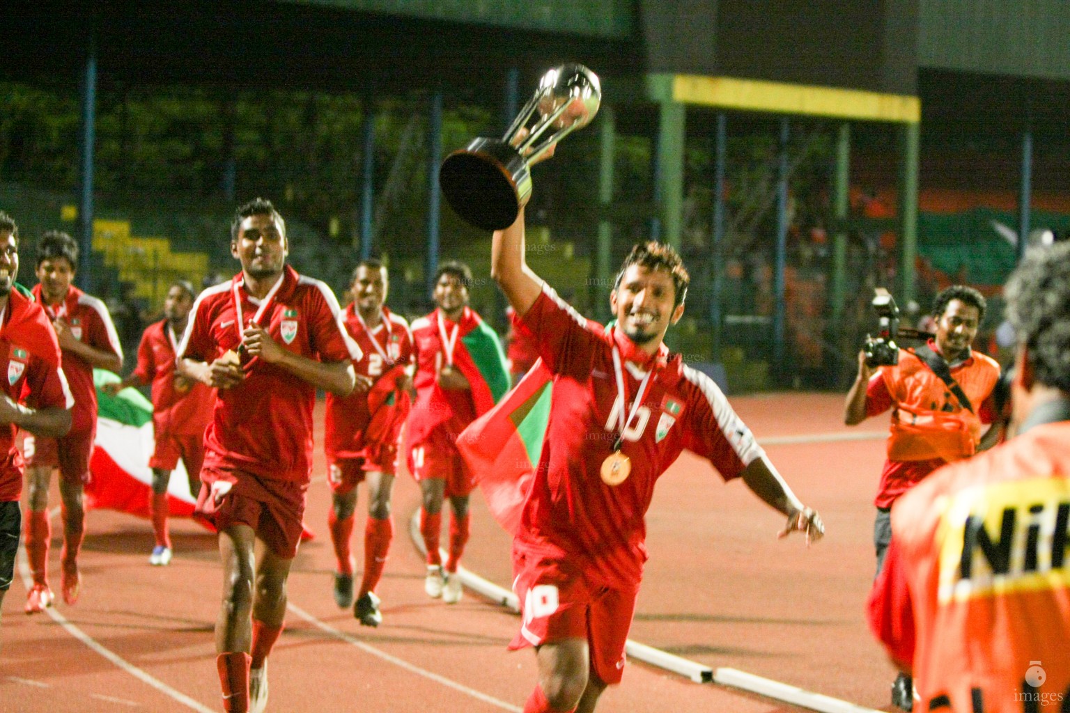 Maldivian players and officials celebrate wafter winning the SAFF Championship, Saturday, June. 14, 2008  (Archived  Photo/ Hussain Sinan).