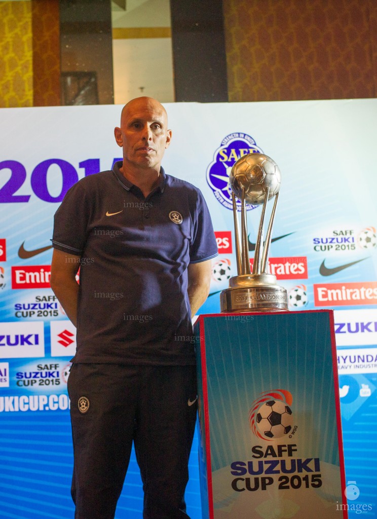 Indian coach poses with the SAFF Suzuki Cup trophy ahead of the finals in Thiruvananthapuram, India, Thursday, January. 2, 2015.  (Images.mv Photo/ Mohamed Ahsan).