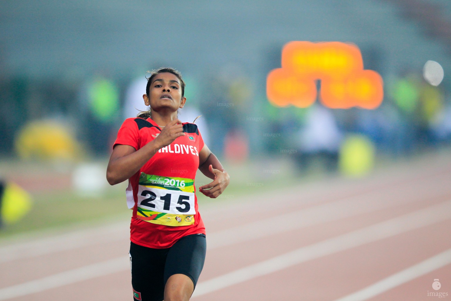 Aminath Nazra runs in the 200m heats in the South Asian Games in Guwahati, India, Thursday, February. 11, 2016. (Images.mv Photo/ Hussain Sinan).