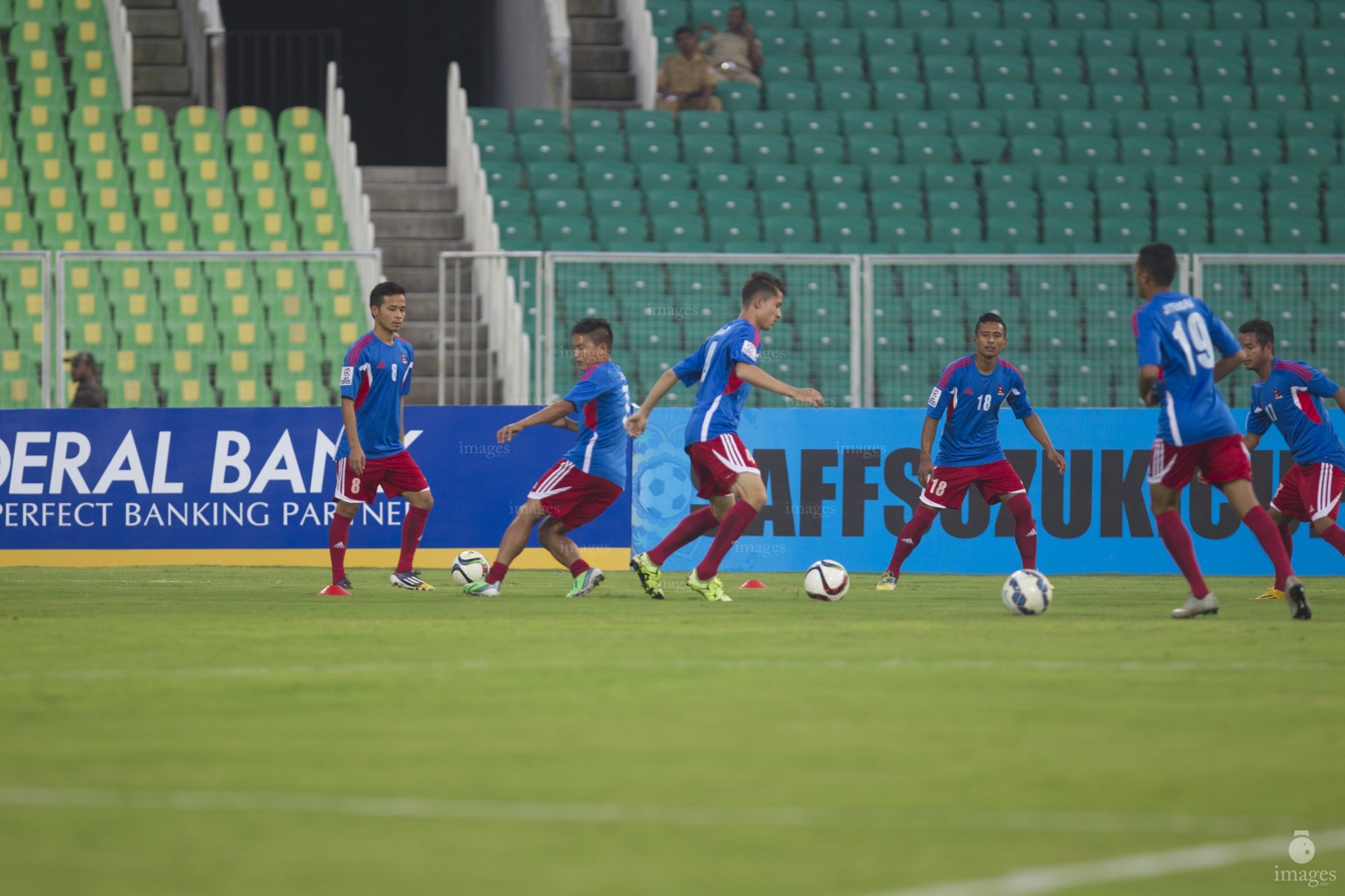 Players of Sri Lanka and Nepal warms up ahead of the SAFF Suzuki Cup opening match in Thiruvananthapuram, India, Wednesday, December 23, 2015. (Images.mv Photo: Mohamed Ahsan)