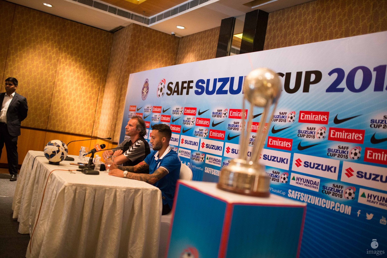 Afghanistan coach and captain poses with SAFF Suzuki Cup trophy ahead of the finals in Thiruvananthapuram, India, Thursday, January. 2, 2015.(Images.mv Photo/ Hussain Sinan).